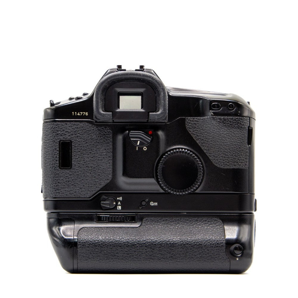 Top plate of the Canon EOS-1 35mm film camera showing shutter button and dials