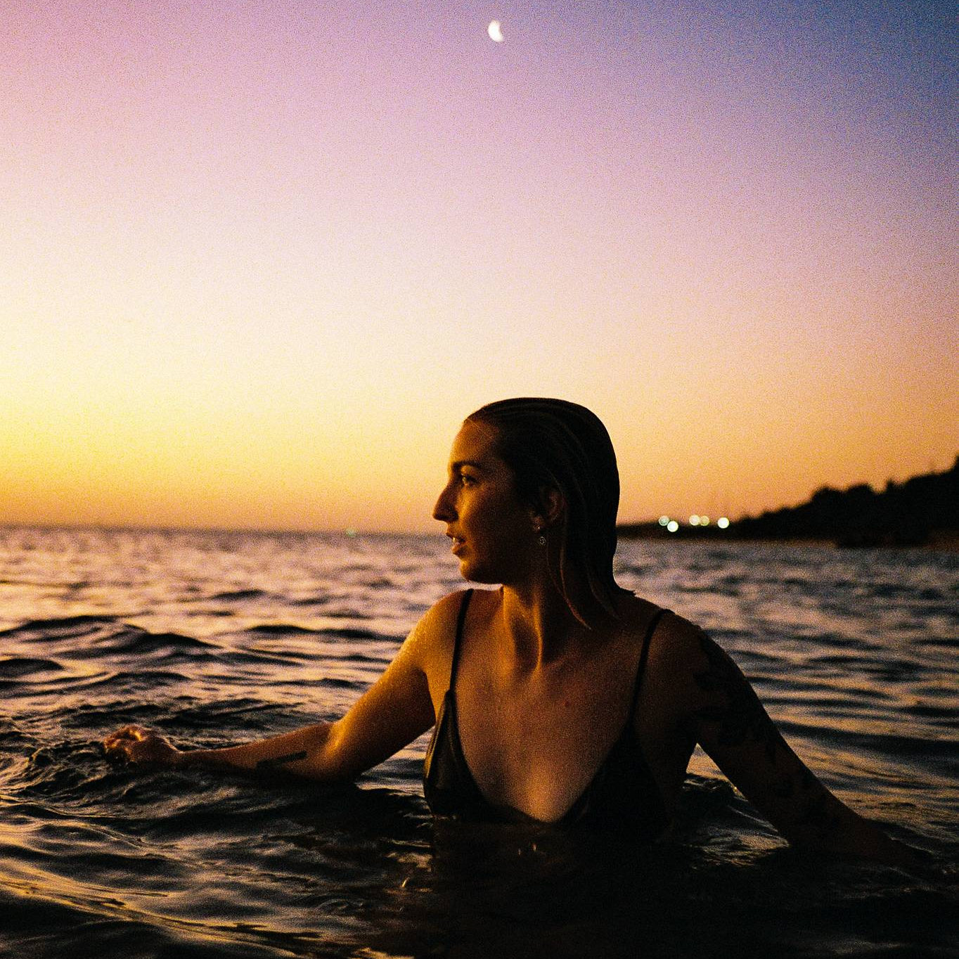 Sample photo taken with the Contax T2 (Titanium). A woman at the beach at sunset wading through water