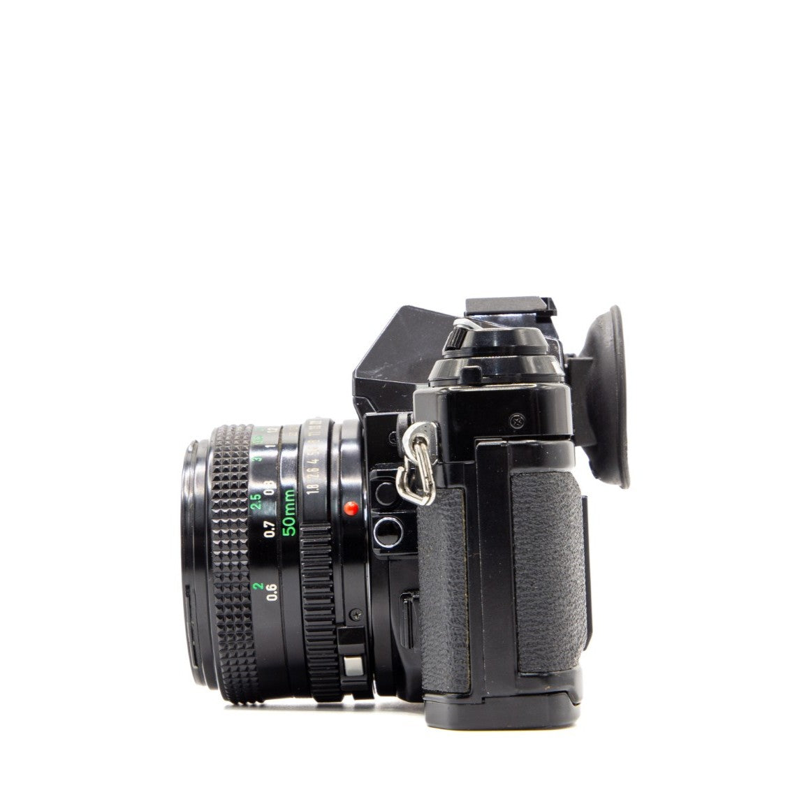 Back view of the Canon AE-1 Program vintage 35mm SLR camera showing film door and controls