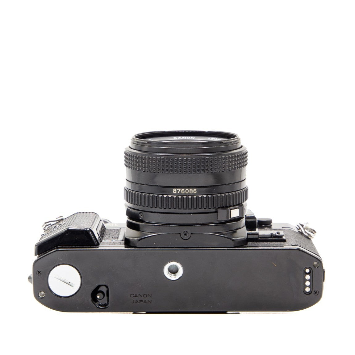 Bottom view of the Canon AE-1 Program 35mm film camera showing baseplate and tripod socket