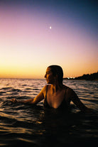 Sample photo taken with the Contax T2 (Titanium). A woman at the beach at sunset wading through water