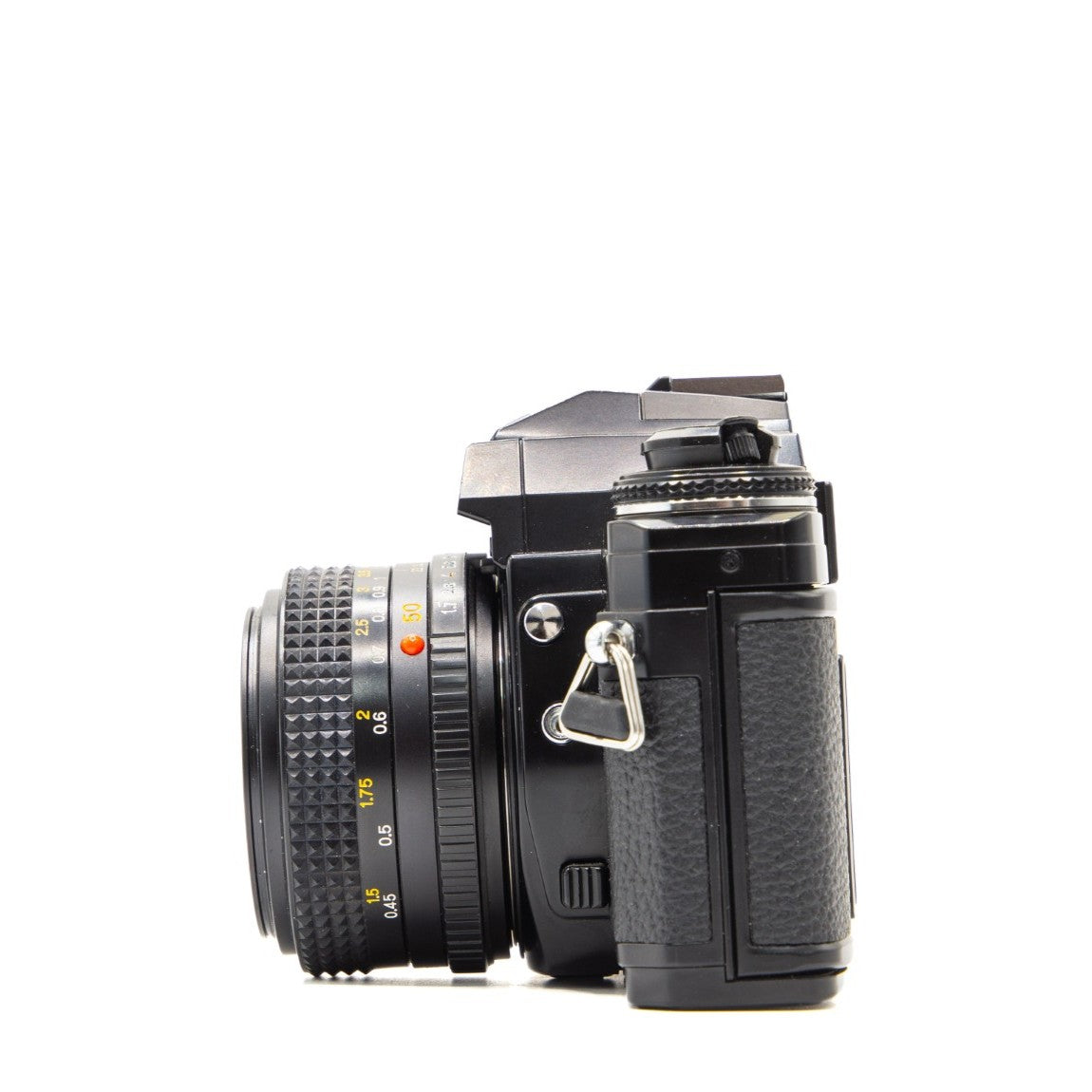 Back view of the Minolta X-700 vintage 35mm SLR camera showing film door and controls