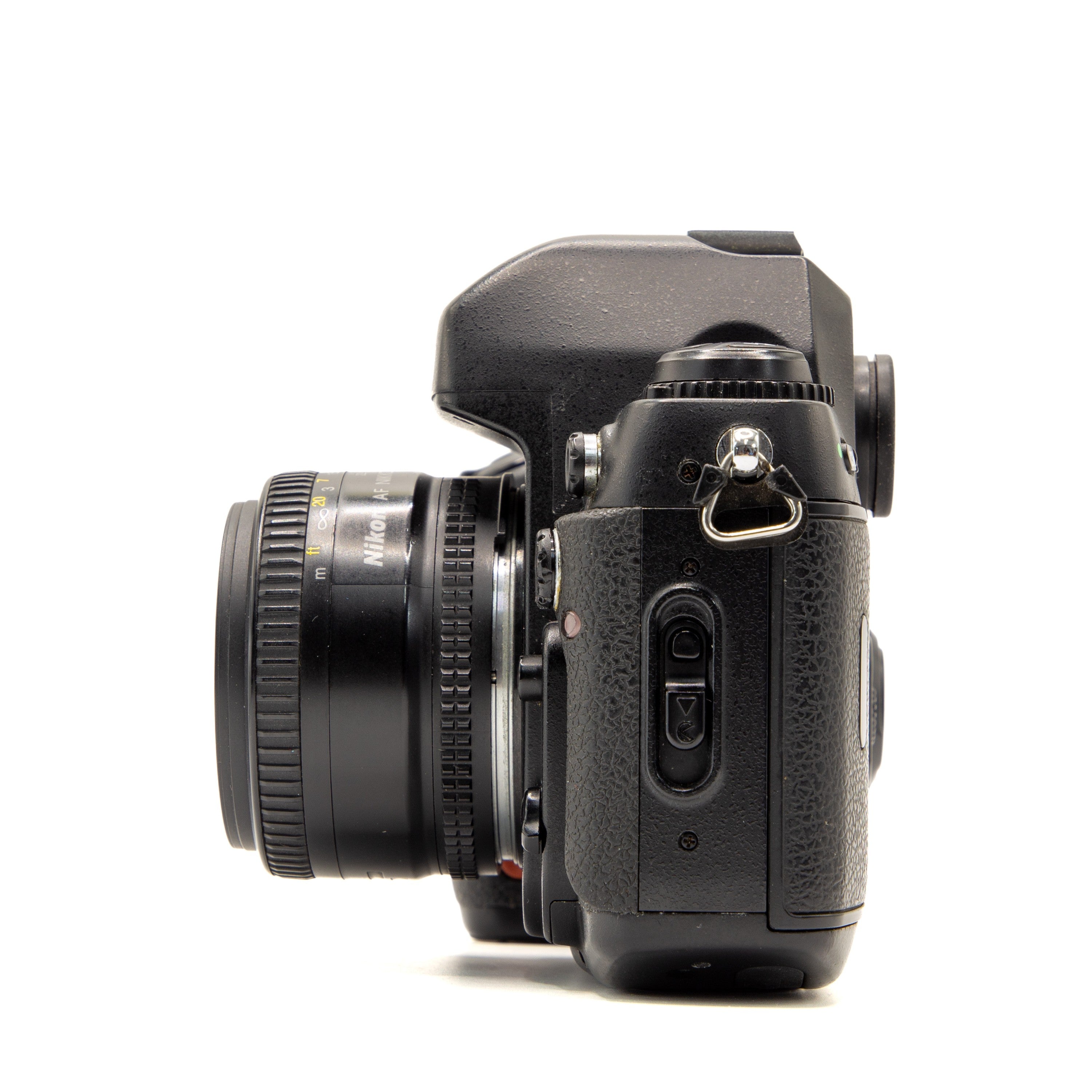 Back view of the Nikon F100 vintage 35mm SLR camera showing film door and controls