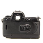 Top plate of the Nikon F100 35mm film camera showing shutter button and dials