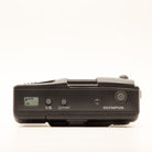 Top plate of the Olympus AF-1 Super 35mm film camera showing shutter button and dials