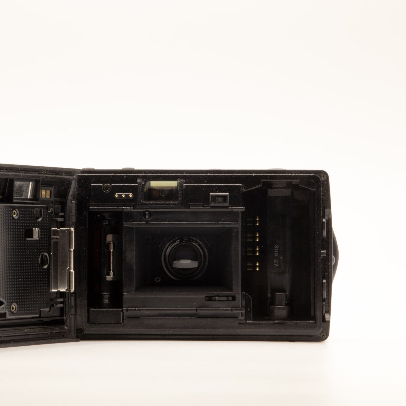 Internal view of the Olympus AF-1 Super lens mechanism and mechanics – 35mm film camera close-up