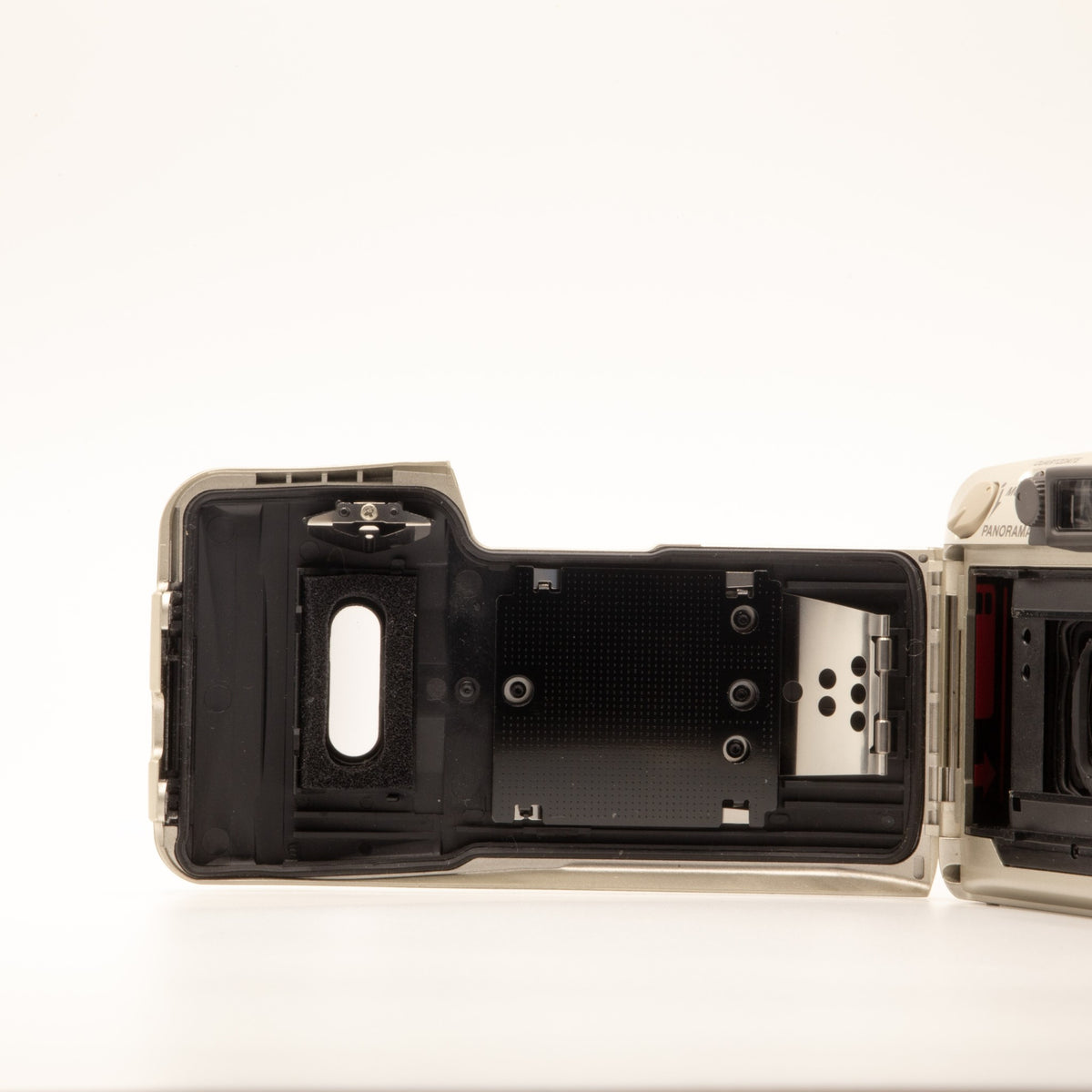 Olympus MJU Zoom 140 film chamber door internals, showing the 35mm film loading mechanism