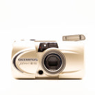 a photo of an vintage olympus 35mm point-and-shoot film camera